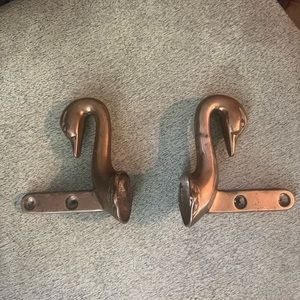 Gorgeous vintage brass swan head rack ends